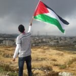 man waving flag