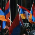a group of people holding flags