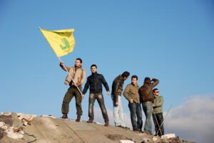 posing with hezbollah flag