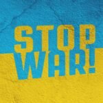 a blue and yellow wall with the words stop war painted on it